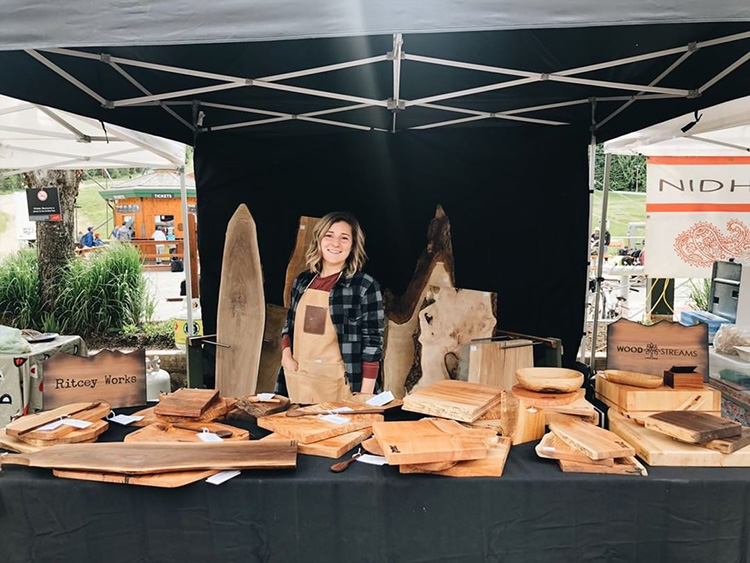 Wood cutting boards on display at the Whistler Farmers' Market