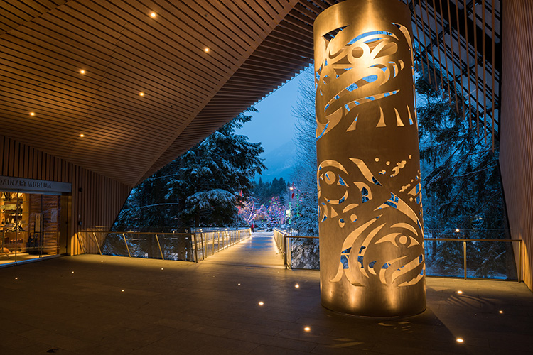 Metal sculpture lit up at the entrance of the Audain Art Museum