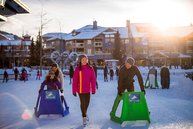 Family skating at Whistler Olympic Plaza