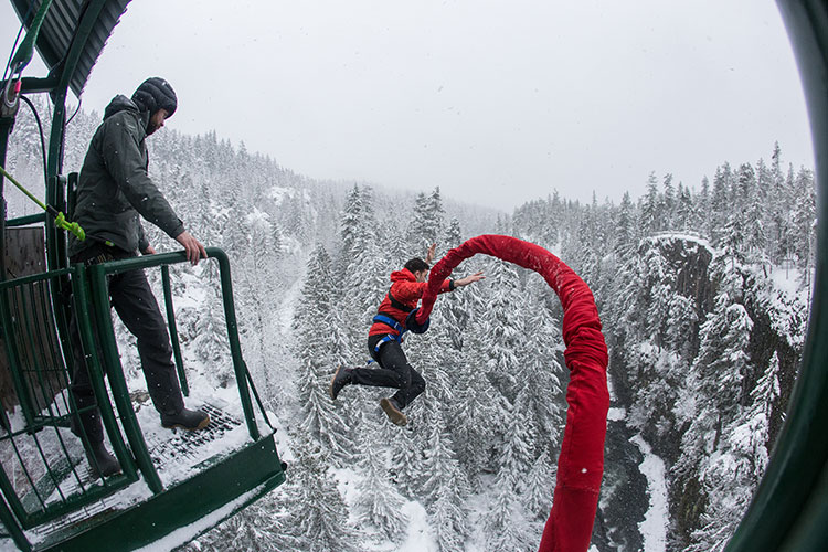 A man takes a leap off the bridge at Whistler Bungee.