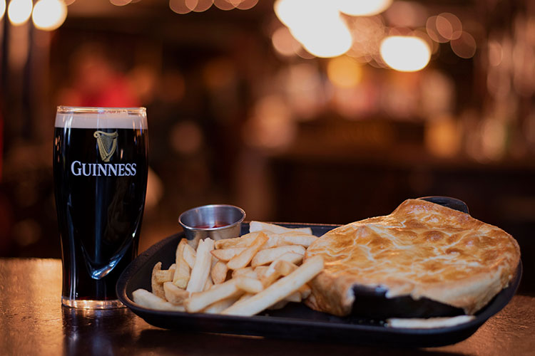 A pie with chips and a beer at the Dubh Linn Gate in Whistler.