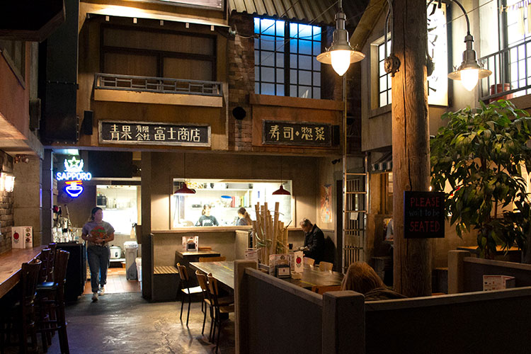 The inside at Ohyama Ramen looks like the streets of Tokyo.