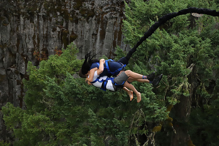 A couple takes the plunge off the bridge at Whistler Bungee.