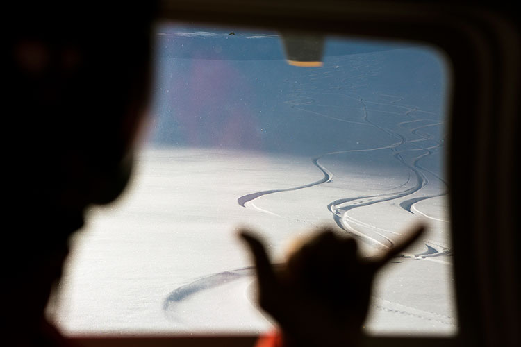 Fresh ski tracks in the snow seen from the helicopter