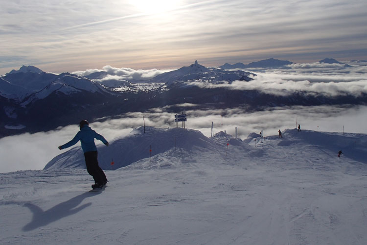 snowboarder on upper peak to creek