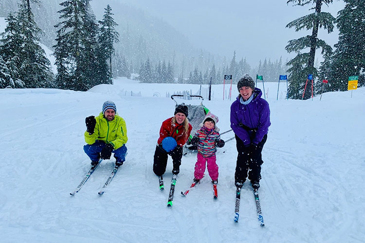 A family out for a day learning to cross country ski at Whistler Olympic Park.