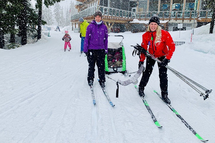 A family cross country skiing at Whistler Olympic Park.