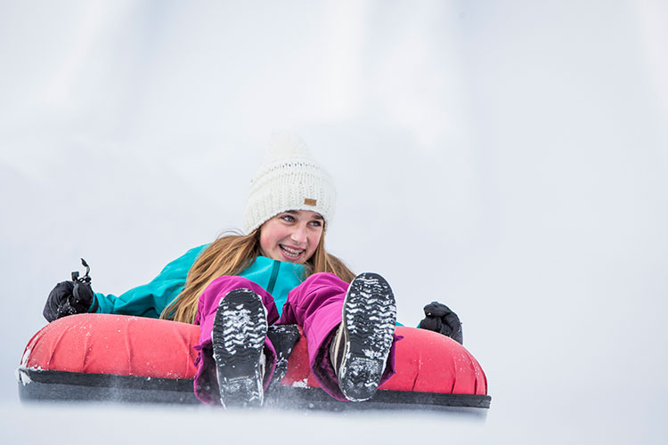 A teen at the tube park in Whistler.