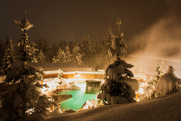 A snowy hot tub at the Scandinave Spa in Whistler