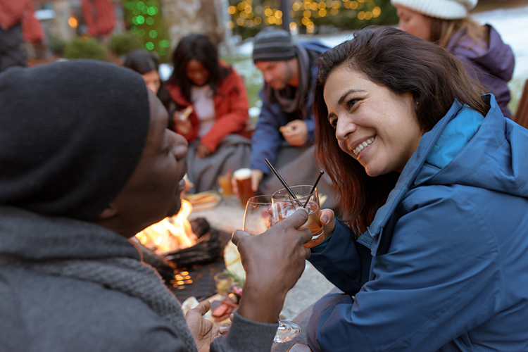 Couple enjoying an outdoor firepit in Whistler