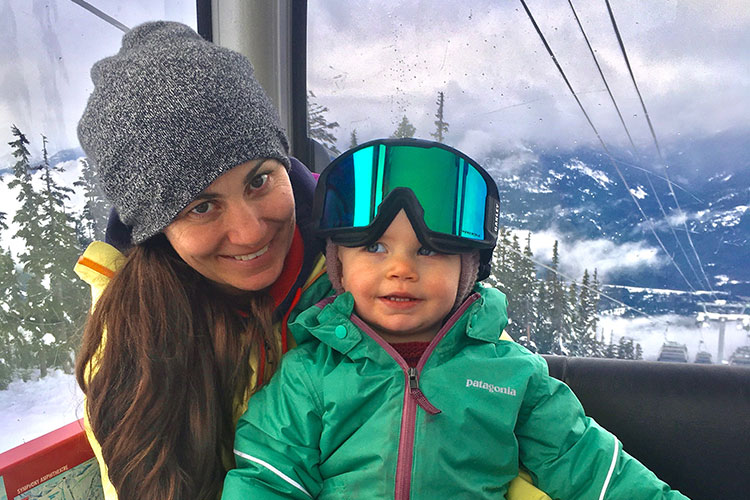 Olympian Maelle Ricker rides the Whistler Village Gondola with her baby girl.