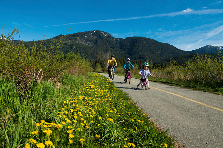 Family biking on the Valley Trail in Whistler