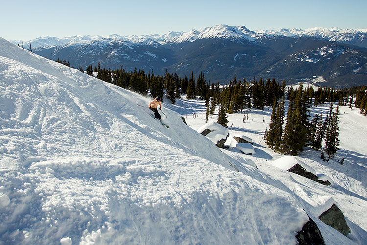 A skier tackles the bottom area of Secret Chute on Whistler Blackcomb.