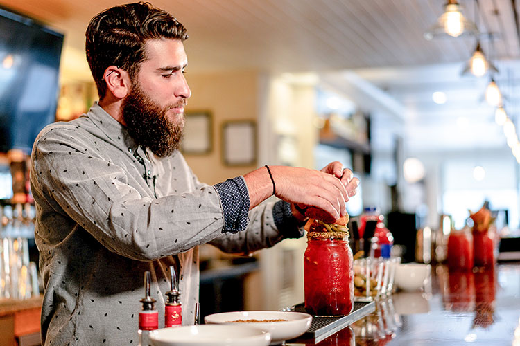 A bartender makes a Caesar cocktail at the Stonesedge Kitchen in Whistler.