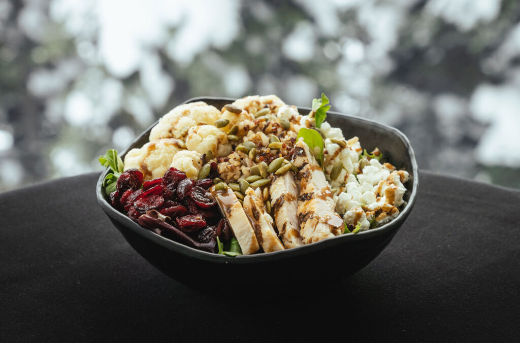 A healthy bowl of chicken, salad, berries and cauliflower from the Roundhouse Lodge on Whistler Mountain.