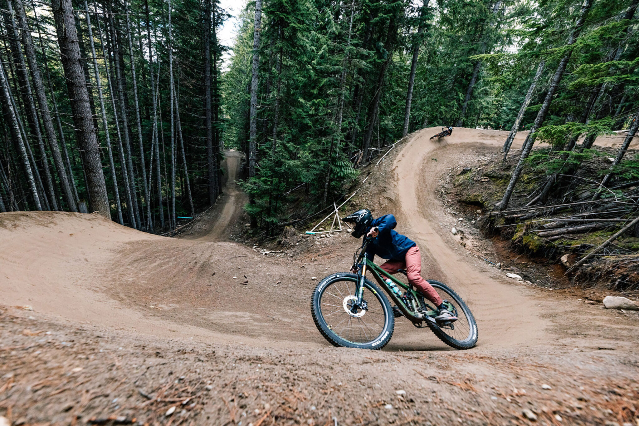Two bikers ride the Whistler Mountain Bike Park in the fall.