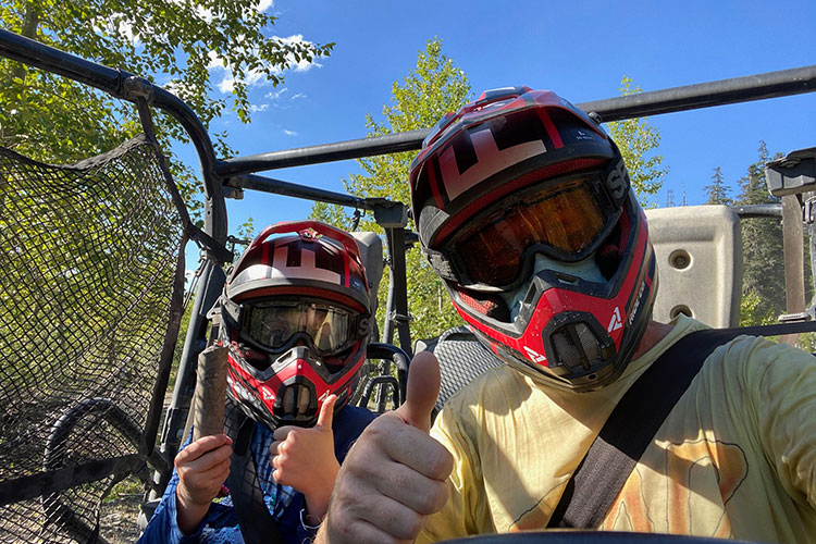 A father and son give their off-road mountain buggy tour the thumbs up in Whistler.