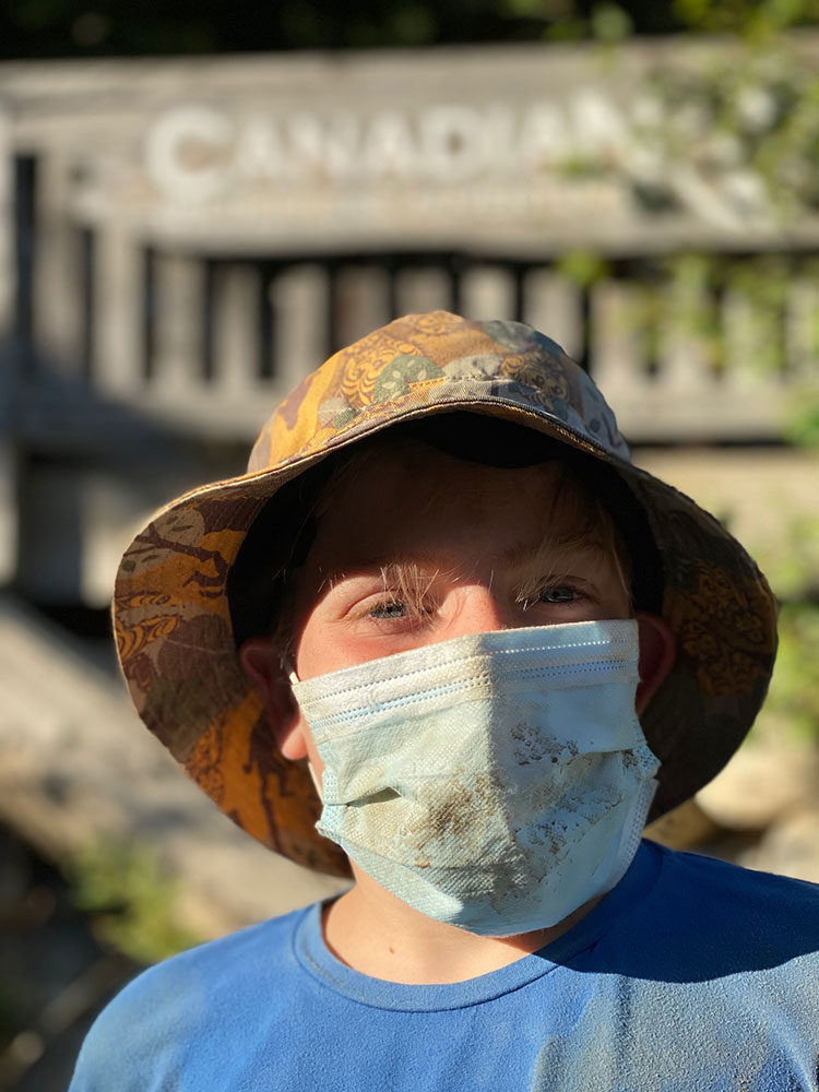 Henry looks at the camera with his face mask on after the mountain buggy tour.