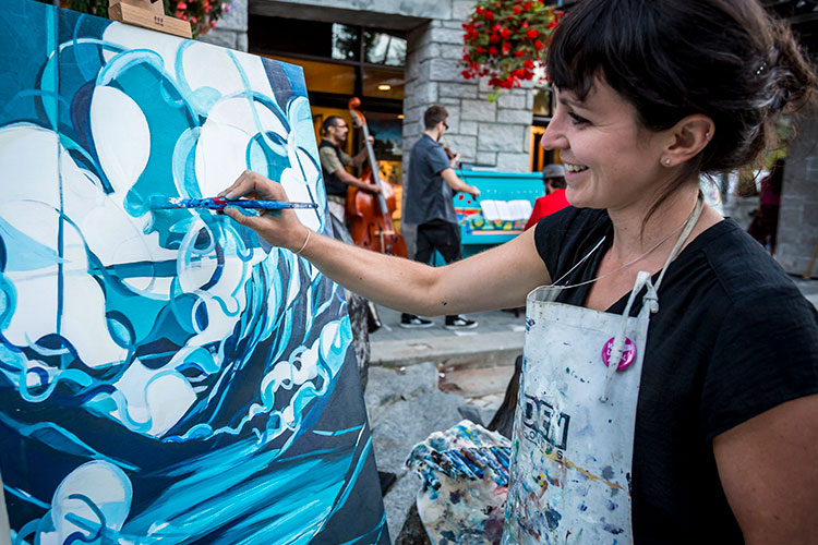 Whistler artist, Jessa Gilbert, paints at an art night in Whistler.