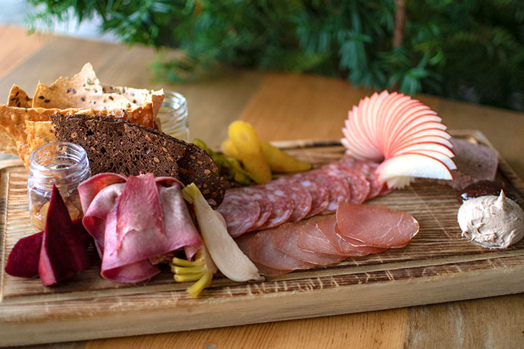 Alta Bistro's charcuterie board is a colourful display of meats, cheeses, fresh fruit and crackers.