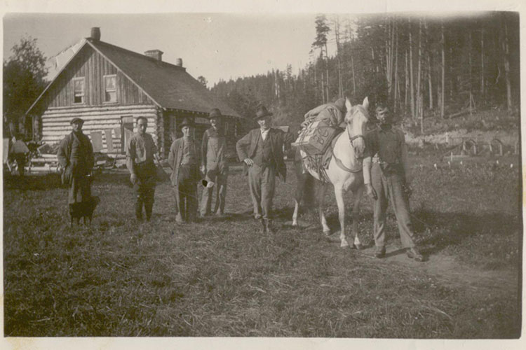 An archival photograph of a group of early Whistler settlers, including Bill Bailiff.