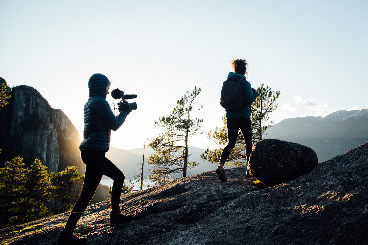 Women hiking and filming Nature Entwind