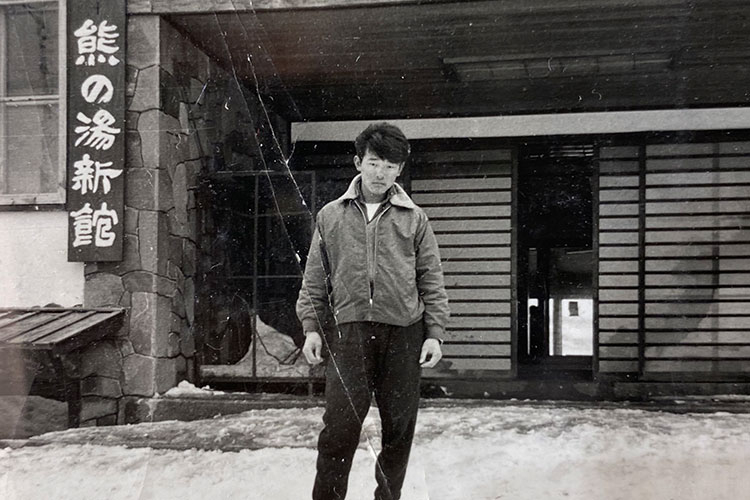 Toshi Hamazaki faces the camera for a black and white shot in Japan.