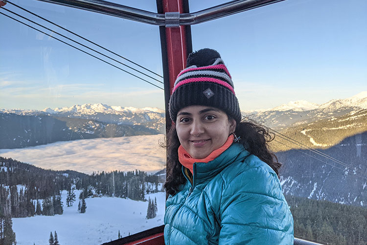 Prajakta Kharkar Nigam smiles at the camera while travelling across the PEAK 2 PEAK Gondola in Whistler.