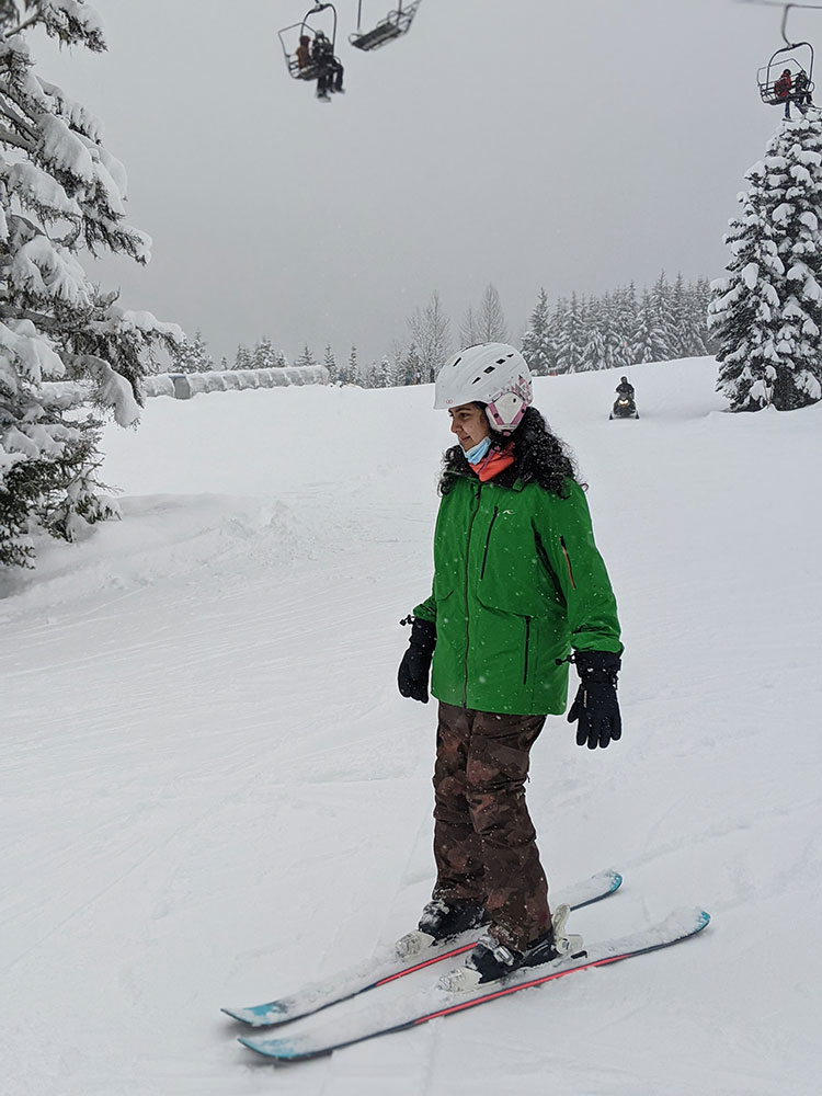 A beginner skiers slides down a green run on Whistler Mountain.