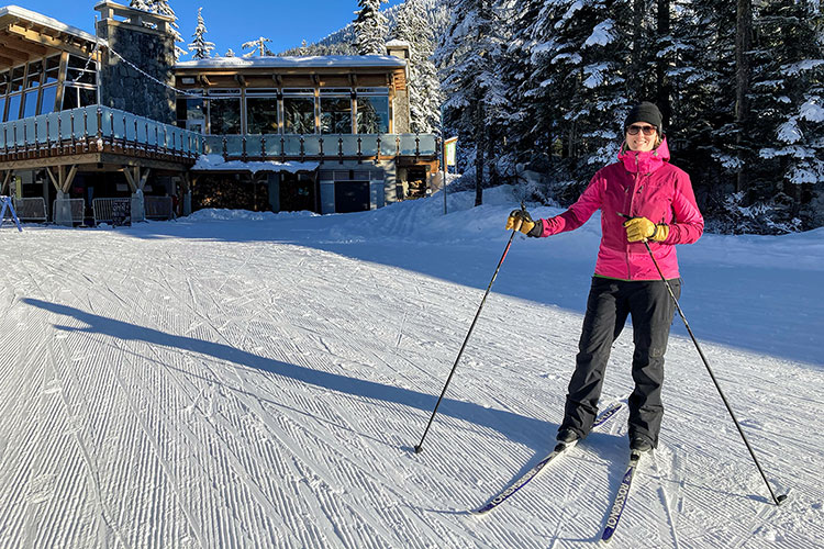 Kylie Wilkins stands on her cross-country skis outside of the lodge at Whistler Olympic Park.