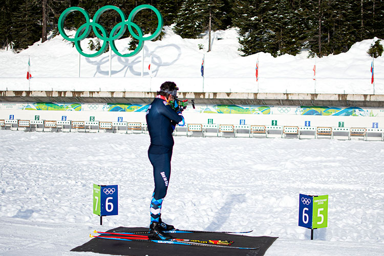 One of the biathlon pros takes a shot at the target from standing at Whistler Olympic Park.