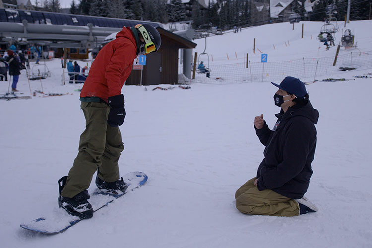 Court Larabee coaches a young snowboarder at the base of Blackcomb Mountain in Whistler.