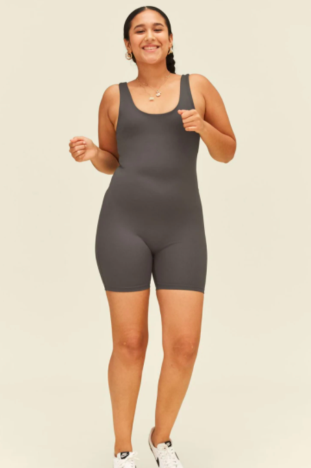 A woman models the Bike Unitard from Girlfriend Collective.
