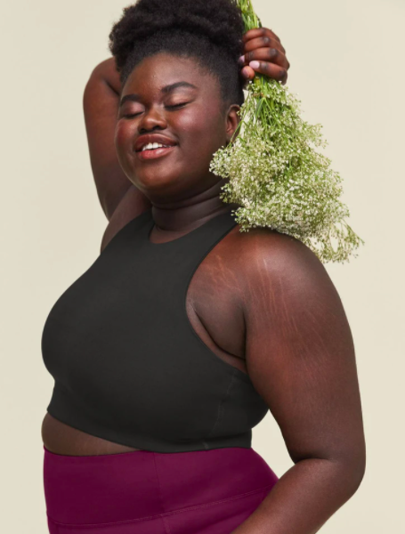 A woman models the Dylan Bra from Girlfriend Collective.