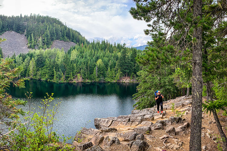 A woman hikes around Loggers Lake in Whistler.