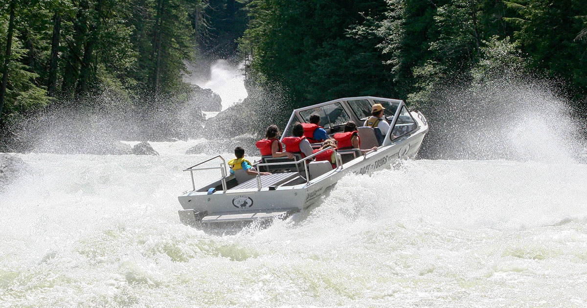 People ride through white water rapids with Whistler Jet Boating.