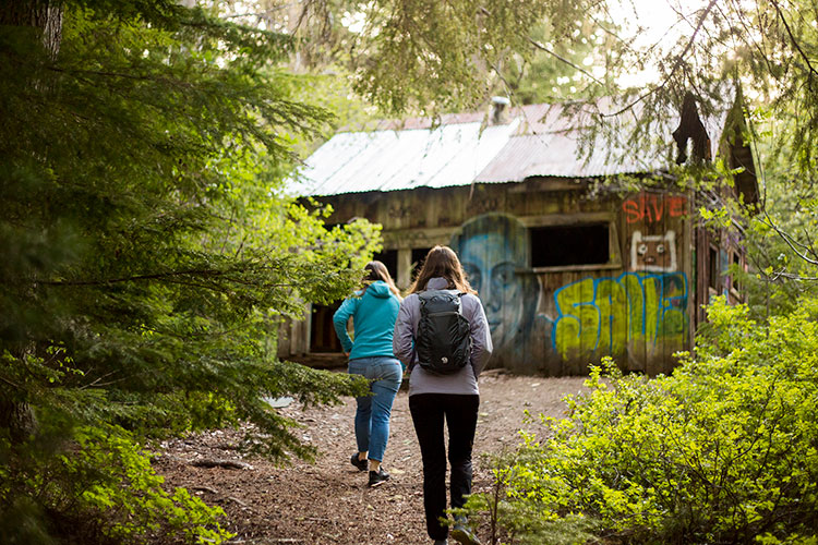 Two women find an old cabin at the Parkhurst site in Whistler.