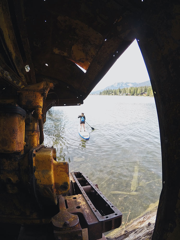 A paddle boarder comes to Parkhurst from Green Lake.