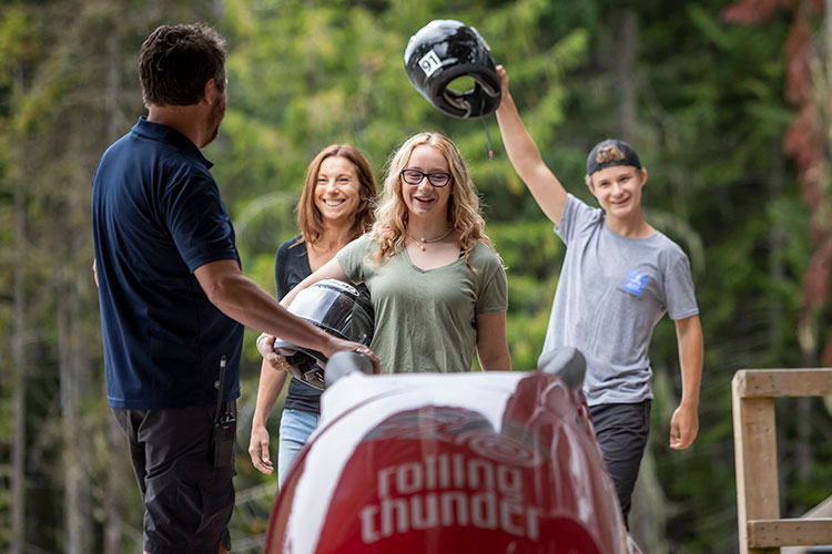 A family get into a bobsleigh to experience Rolling Thunder.