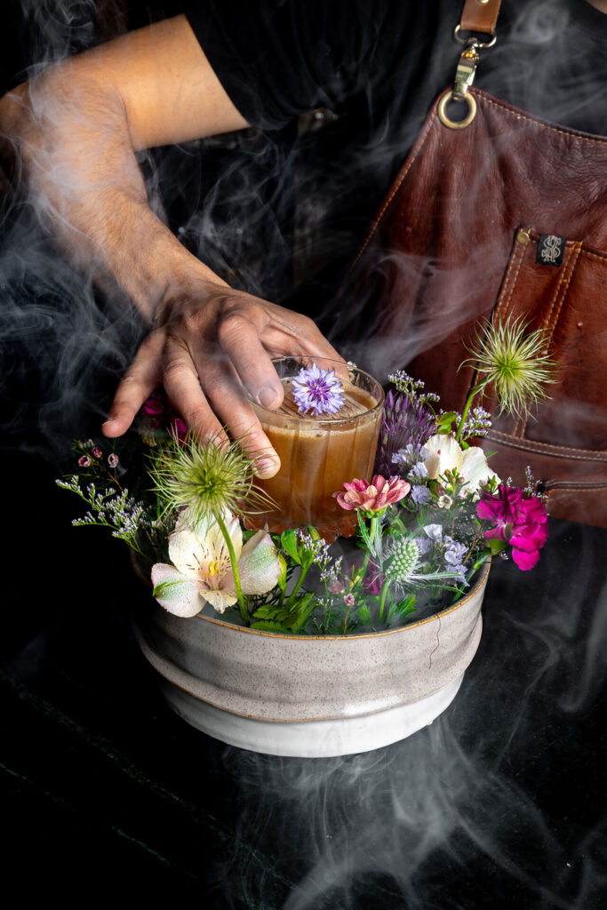 The Bruce's Garden cocktail at the Four Seasons's Braidwood Tavern comes surrounded by flowers. 