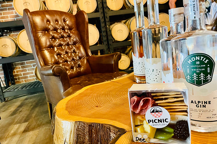 The tasting room at Montis Distilling, featuring their Alpine Gin and a charcuterie box by Picnic Whistler.