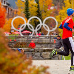 A runner comes into Whistler Village at the end of the Whistler 50 Relay and Ultra amidst the fall colours.
