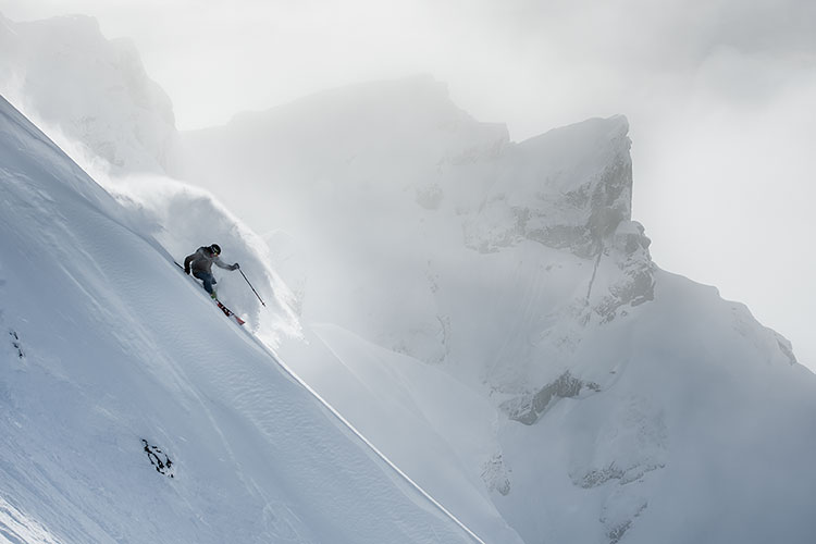 A skier tackles steep, powdery terrain on Whistler Blackcomb.