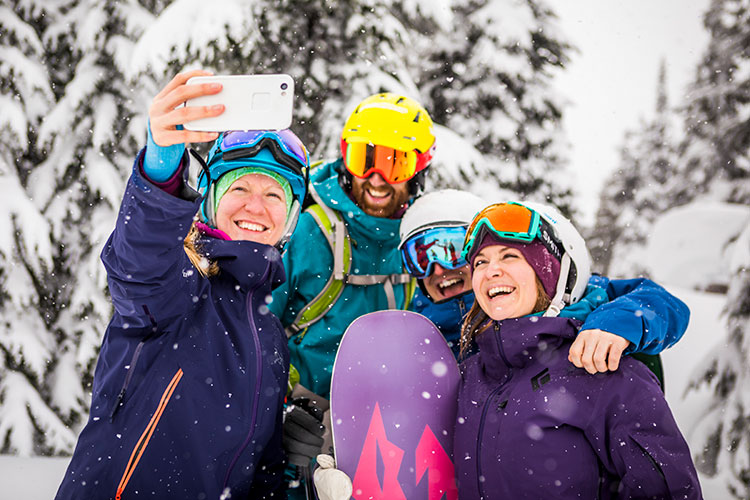 A group of friends pose for a selfie on Whistler Blackcomb.