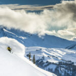 A skier rips into powder as they ride down a slope on Whistler Blackcomb.