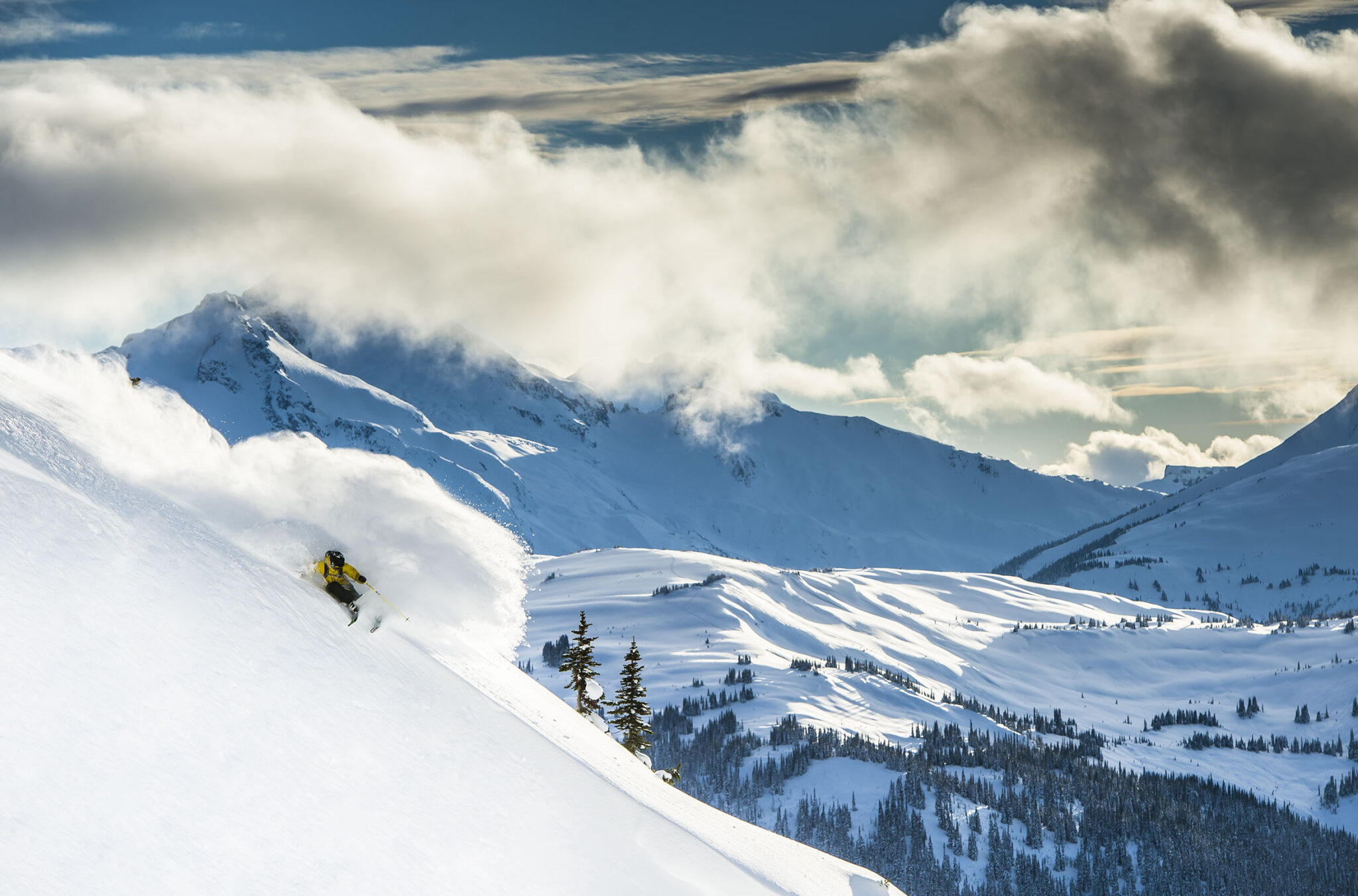 A skier rips into powder as they ride down a slope on Whistler Blackcomb.