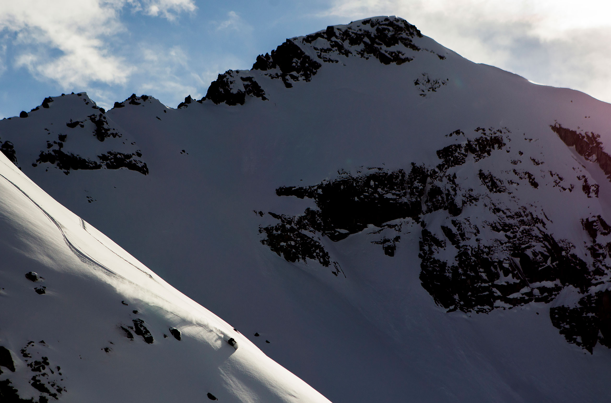 A skier curves down the mountain in the Whistler backcountry.