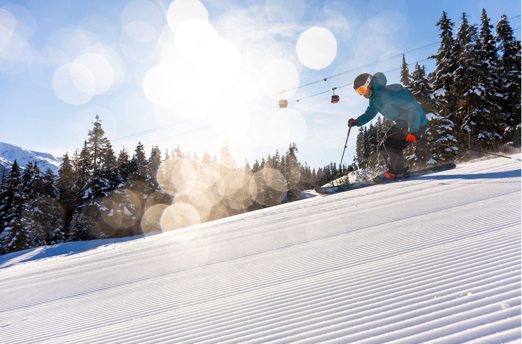 A skier gets corduroy in the spring sunshine on Whistler Blackcomb.
