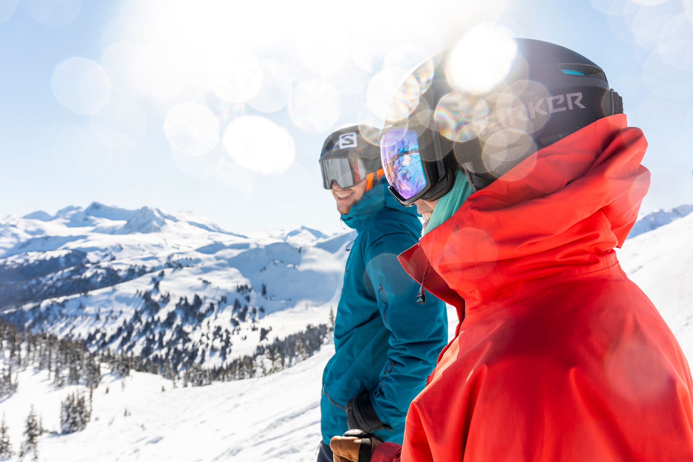 Two skiers stop to enjoy the sun on Whistler Blackcomb.