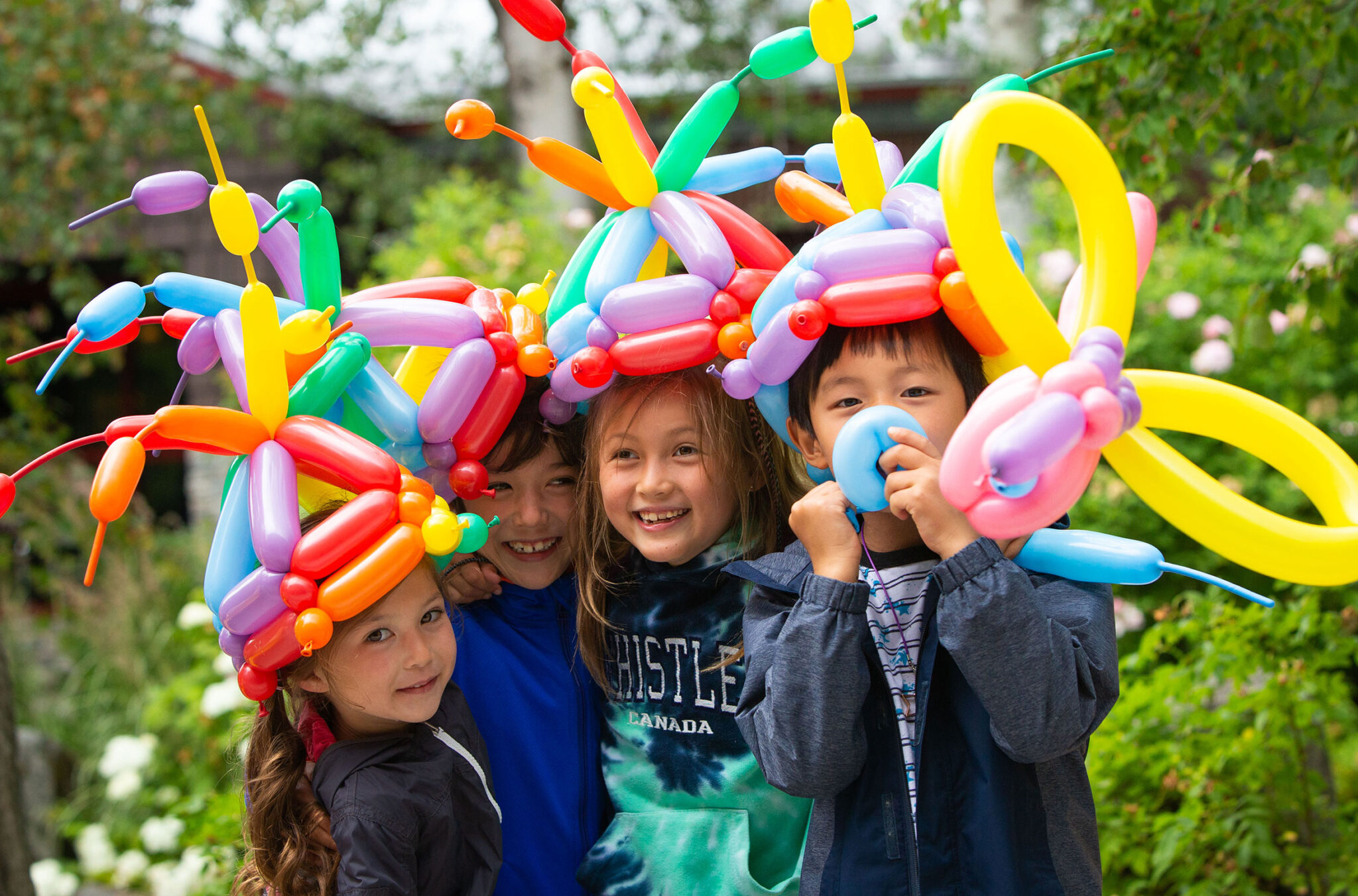 A group of young children enjoy wearing balloon crowns at the Whistler Children's Festival.